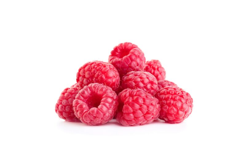 pile of fresh ripe raspberry fruits isolated on white background